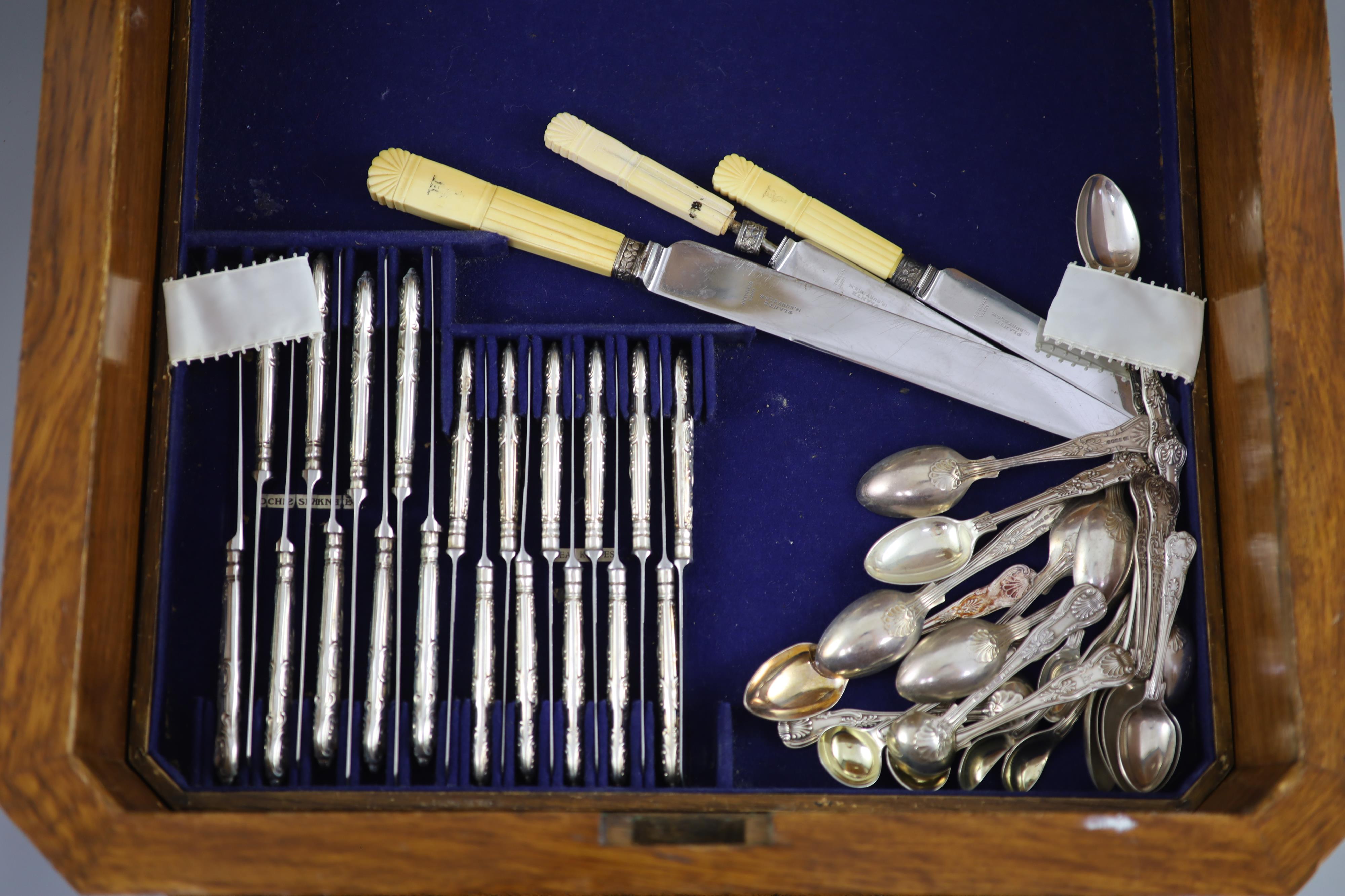 A part canteen of late Victorian silver double struck Queens pattern cutlery by Carrington & Co